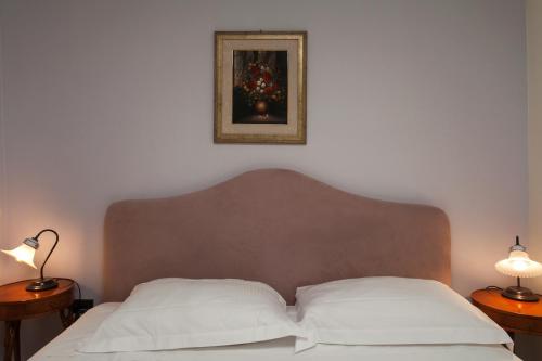 Un ou plusieurs lits dans un hébergement de l'établissement Zodiacus Residence