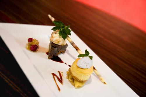 a plate of food with ice cream on a stick at Sterling Inn & Spa in Niagara Falls