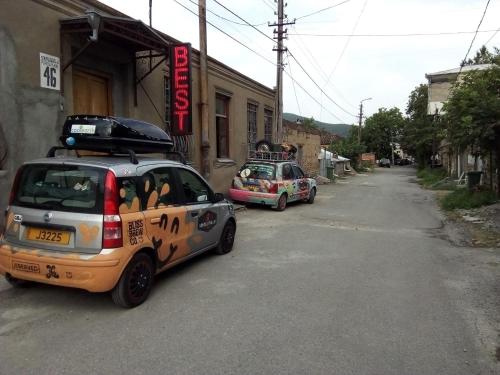 two cars parked on the side of a street at Best Host in Sighnaghi