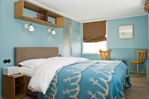 Una cama o camas en una habitación de Hótel Egilsen