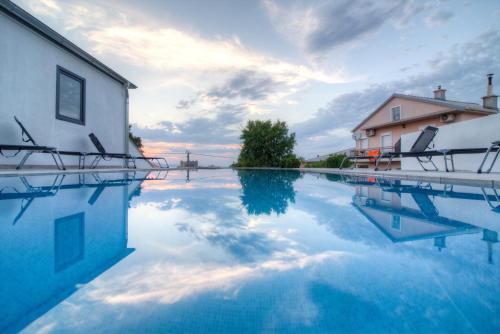 a pool of water in front of a building at BC Eleven - mit Zentralheizung in Senj