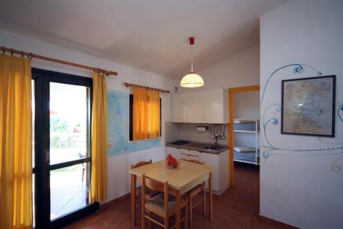 Cucina o angolo cottura di Residence Baia Salinedda