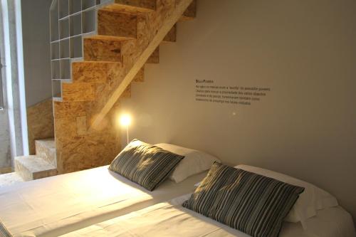 a bedroom with a bed with two pillows on it at StayInn City - Póvoa de Varzim in Póvoa de Varzim
