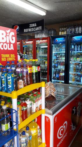 a store with a big cola counter with drinks at Hostal Santa María Gracia in Quito