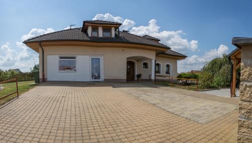 a small white house with a roof at ubytování u Smolíků in Třeboň