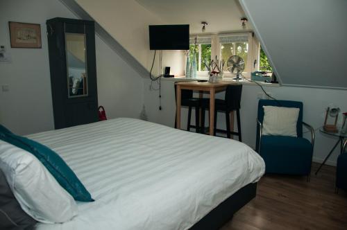 Giường trong phòng chung tại De Langenlee