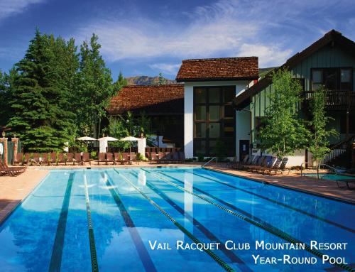 a swimming pool in front of a hotel at Vail Racquet Club Mountain Resort in Vail