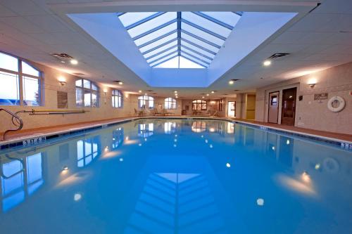 a large swimming pool with a skylight in a building at Shilo Inn Killeen in Killeen