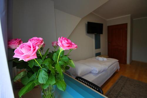 Ένα ή περισσότερα κρεβάτια σε δωμάτιο στο Apartamenty Dorotowo