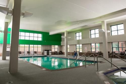 a large swimming pool in a large building at Isle Casino Hotel Bettendorf in Bettendorf