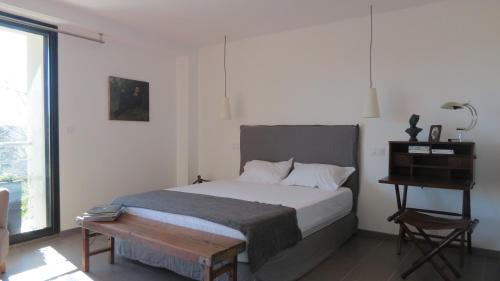 Säng eller sängar i ett rum på Le Castellas du Pic St Loup