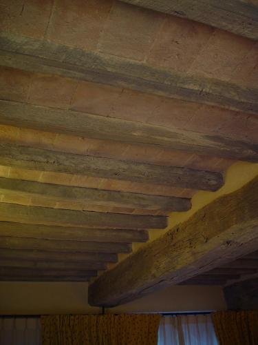 a close up of a wooden ceiling in a room at Agriturismo La Sovana in Sarteano