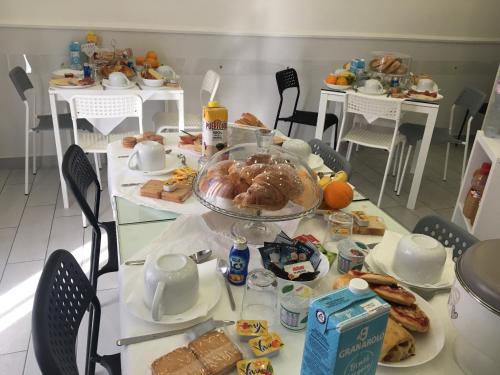 a table full of breakfast foods and drinks at Maison De luxe in Pompei