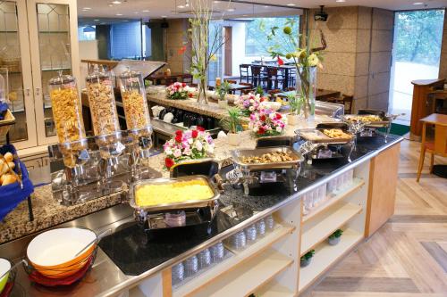 a buffet line with many trays of food at Day Nice Hotel Tokyo in Tokyo
