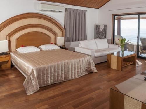 Ένα ή περισσότερα κρεβάτια σε δωμάτιο στο Hotel Paradis d'Ouvéa