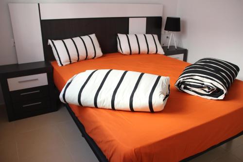 A bed or beds in a room at Flat La Marina del Pinet