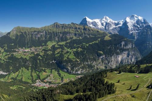 an aerial view of a valley in the mountains at O 68 Haus Bel Air in Wengen