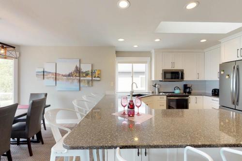 a kitchen with a large island in the middle of a room at Wapato Point Lakeview in Manson
