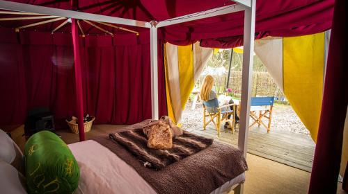 A bed or beds in a room at Knights Glamping at Leeds Castle 