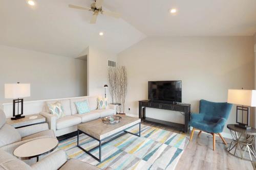 a living room with a couch and a tv at Wapato Point Lakeview in Manson