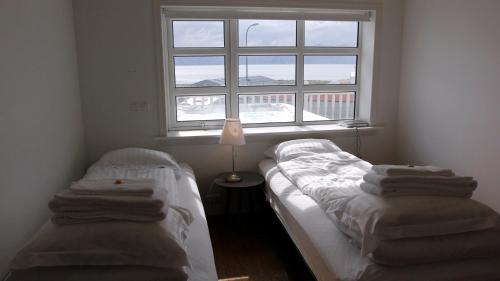 Postel nebo postele na pokoji v ubytování Askja Apartment