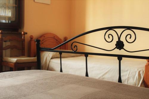a close up of a bed in a bedroom at mansarda fiorita in Abatemarco