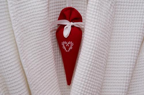 a red shoe with a white bow on a white shirt at Barcaldine Castle in Oban