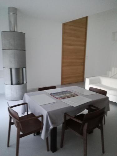 a dining room with a table and some chairs at La casa di Mario tra le case in Ortona
