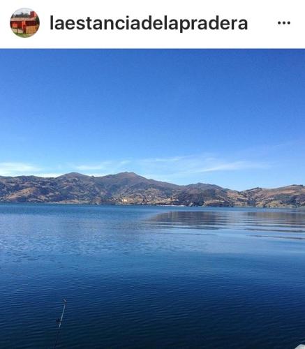 a picture of a lake with mountains in the background at La Estancia de la Pradera Cabana Fiba in Nobsa