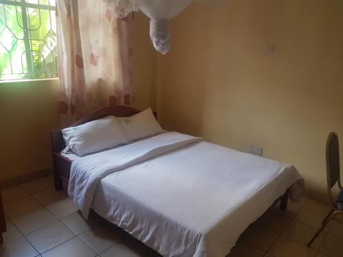 Katil atau katil-katil dalam bilik di Good Samaritan Inn