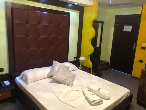 Postel nebo postele na pokoji v ubytování Icon Hotel