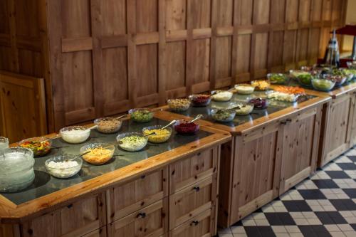 a buffet line with many different types of food at Hotel Astoria in Arosa