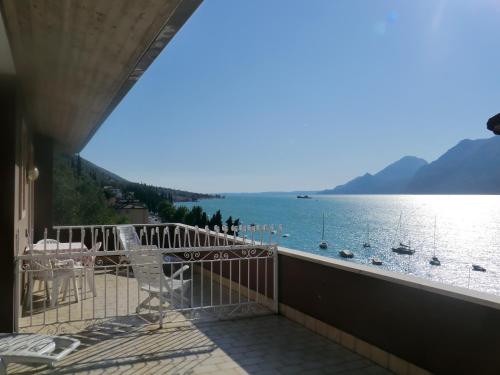 a balcony with a view of the water at B&B Casa Sartori in Malcesine