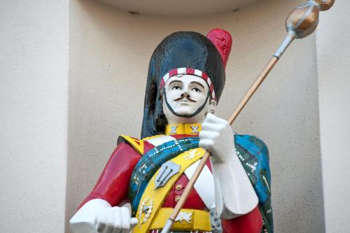 a statue of a man holding a spear at Salutation Hotel in Perth