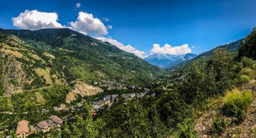 a view of a valley in the mountains at Résidences Alticimes in Brides-les-Bains