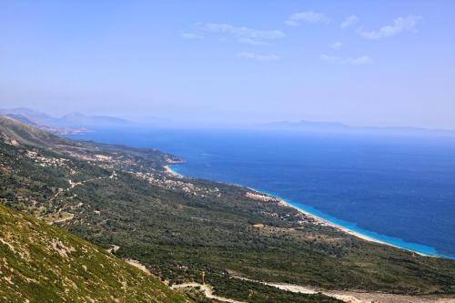 a view of the ocean from the top of a hill at Sofo Hotel Dhermi in Dhërmi