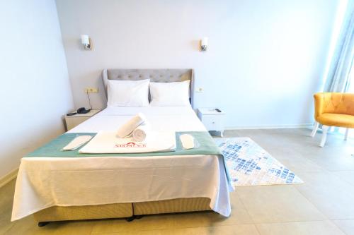 a bedroom with a bed with a towel on it at Nar Palace in Istanbul