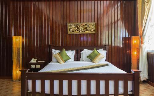 Tempat tidur dalam kamar di Rajapruek Samui Resort - SHA Plus