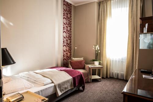 Postel nebo postele na pokoji v ubytování Best Western Premier Hotel Rebstock