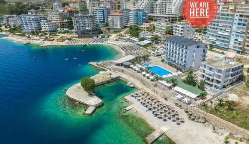 an aerial view of a beach with a resort at Hostel Hasta La Vista in Sarandë