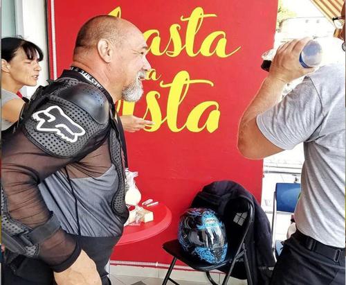 a man wearing a motorcycle vest standing next to a woman at Hostel Hasta La Vista in Sarandë