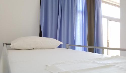 Ein Bett oder Betten in einem Zimmer der Unterkunft Hostel Hasta La Vista
