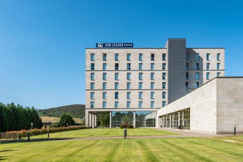 a building with a lawn in front of it at Eurostars San Lazaro in Santiago de Compostela