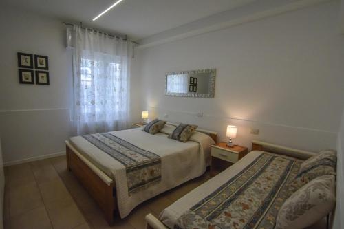 מיטה או מיטות בחדר ב-Villa Norma