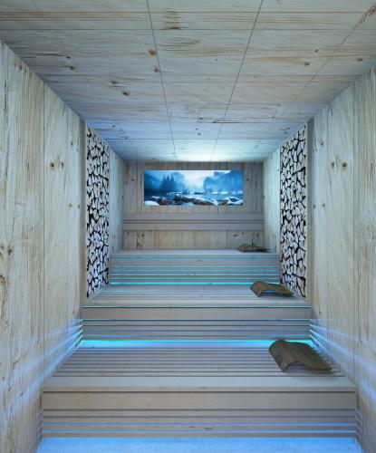 a sauna with wooden walls and stairs with a television at Residence Isabell in Selva di Val Gardena