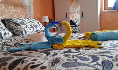 a group of stuffed animals on a bed at B&B Villa Milena in Ariano Irpino