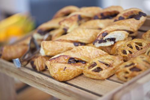 a bunch of pastries sitting on a tray at The Z Hotel Tottenham Court Road in London