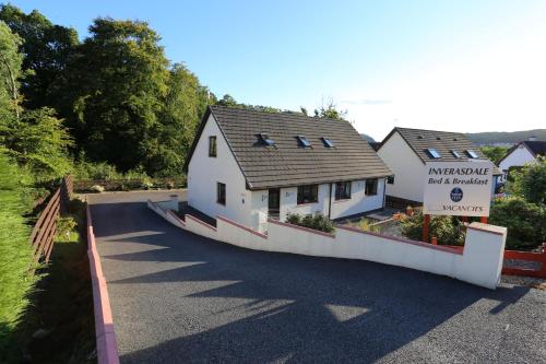 a house on the side of a road at Inverasdale in Oban