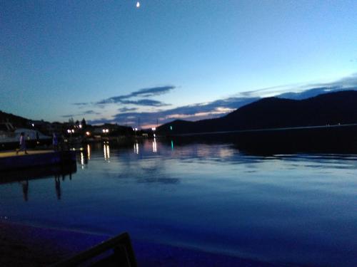 a view of a body of water at night at Blue Dreams in Almiropótamos