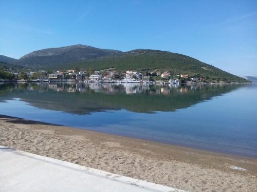 a view of a body of water with houses at Blue Dreams in Almiropótamos